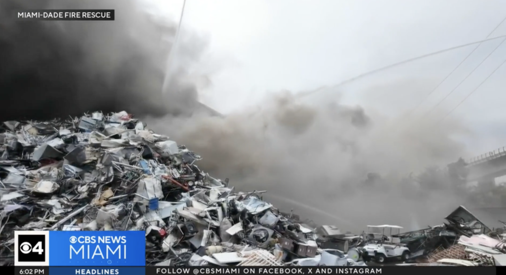 Thick black smoke rising from scrap metal fire at Miami-Dade recycling facility, April 2025